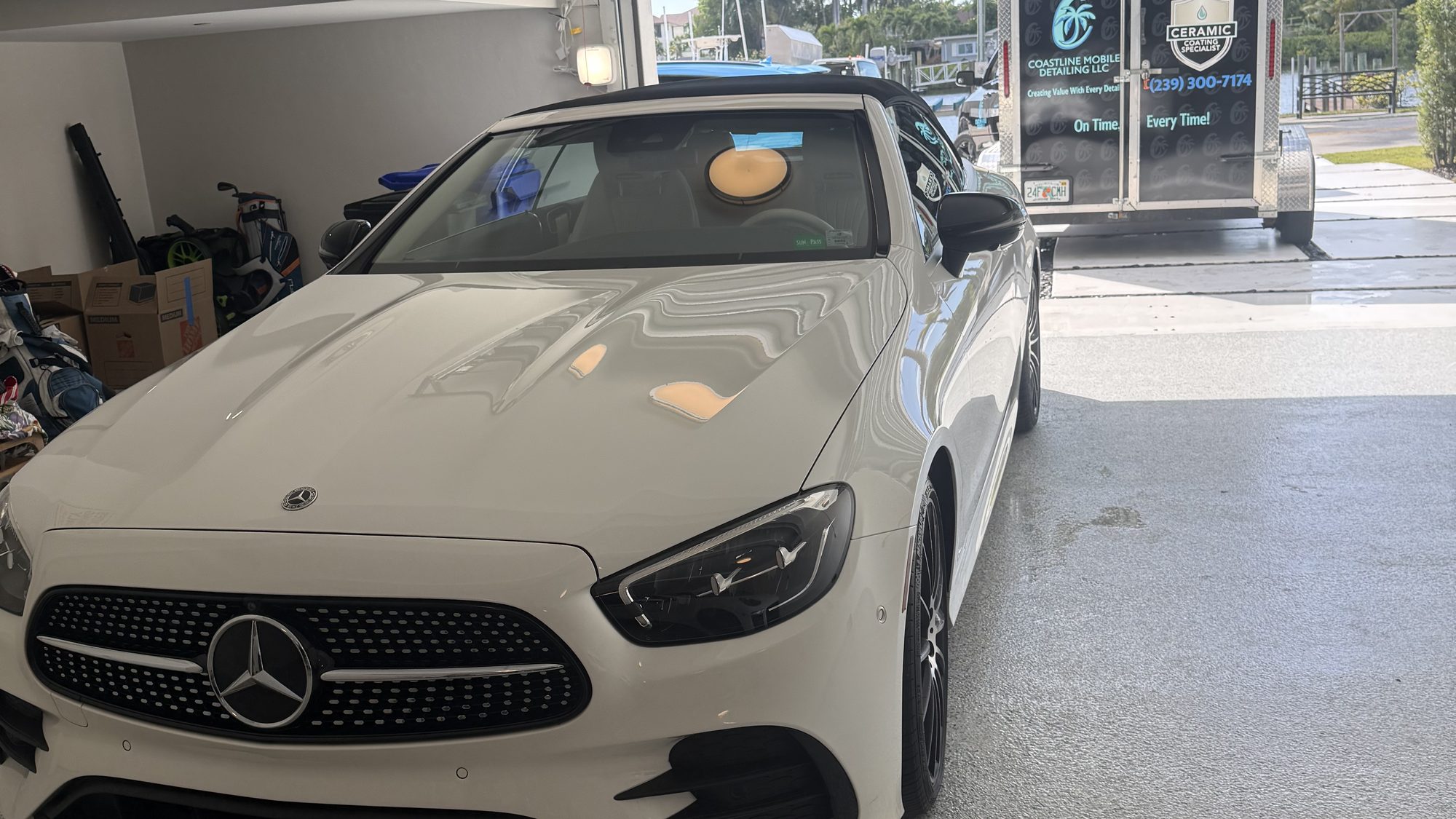 Mercedes gleaming inside a residential garage after detailing